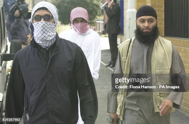 Supporters of muslim extremist group, Al-Muhajiroun, in east London, after attending a news conference held by the group hailing the US September...