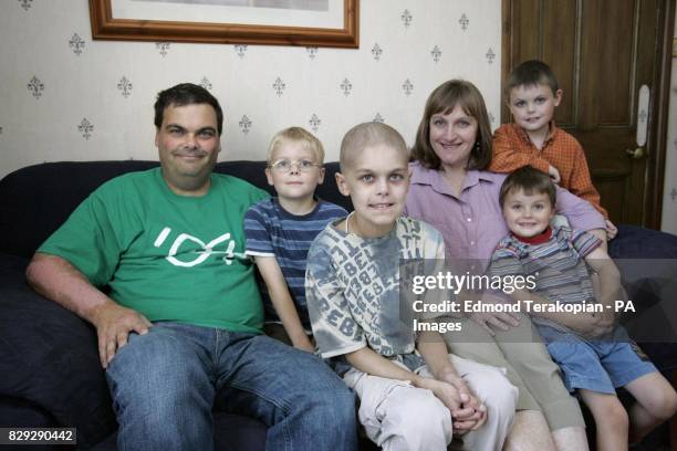Joshua Hartley sits at his home in Romsey, Hampshire, with his family L-R: dad David, Daniel , Joshua , mum Allison, Luke and Nathan , as he begins,...