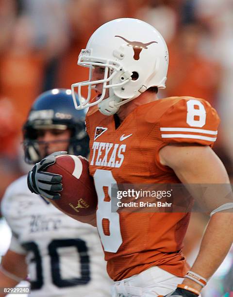 Wide receiver Jordan Shipley of the Texas Longhorns scores the first of two touchdowns untouched on a 30-yard pass against the Rice Owls in the first...
