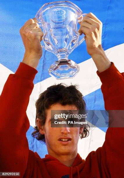 British tennis sensation Andrew Murray celebrates his victory in the boys' US Open on his arrival back in Scotland. The 17-year-old beat Ukrainian...