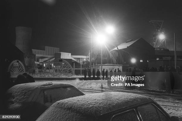 Mantle of snow on the frigid scene outside Askern Colliery, South Yorkshire, as police and pickets await the 4am workers bus to arrive.