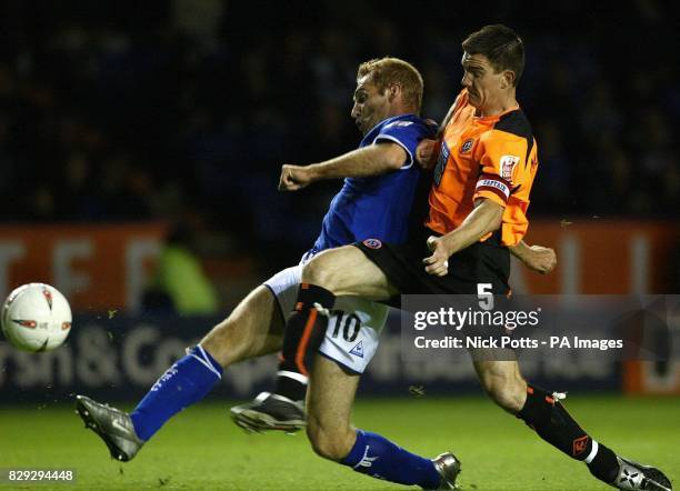 Leicester City's James Scowcroft beats Sheffield United defender Chris Morgan to score the opening goal during the Coca Cola Championship match at...