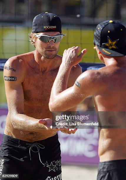 Matt Fuerbringer celebrates with teammate Casey Jennings during a men's quarterfinals match at the AVP Manhattan Beach Open on September 20, 2008 in...