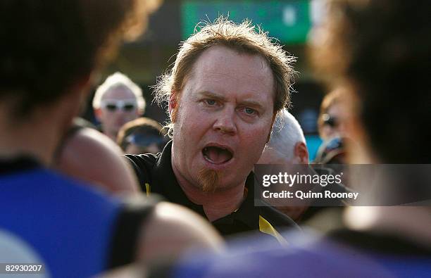 Werribee coach Simon Atkins talks to his players during the VFL 1st Preliminary Final match between North Ballarat and the Werribee Tigers at TEAC...