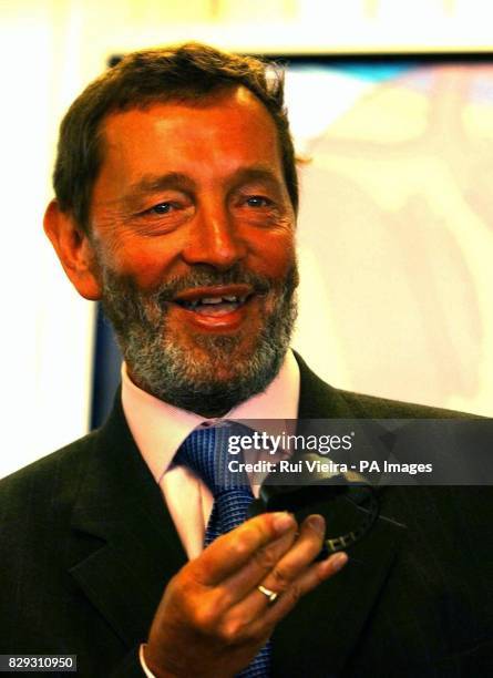 Home Secretary David Blunkett holds an ankle device during the launch of a satellite tracking system that will monitor movements of paedophiles and...