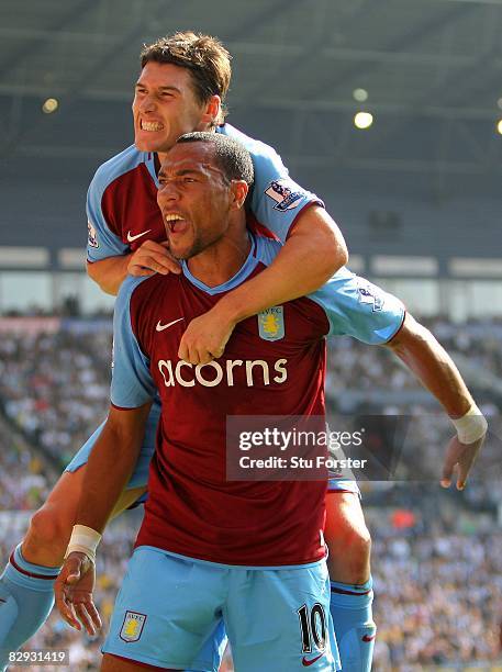 John Carew of Aston Villa celebrates with Gareth Barry after scoring the opening goal during the Barclays Premier League match between West Bromwich...