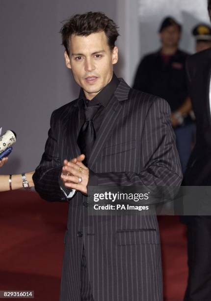 Star of the film Johnny Depp arrives for the premiere of 'Finding Neverland' which also stars Kate Winslet at Mostra Internazionale d'Arte...