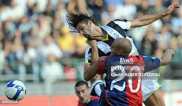 Juventus forward Amauri Carvalho de Oliveira of Brazil fights for the ball with Cagliari defender Paolo Bianco during their Serie A football match at...