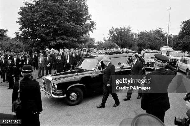 The hearse carrying the coffin of Det Con Alan Holmes, who shot himself after he was questioned by Scotland Yard investigators about allegations...