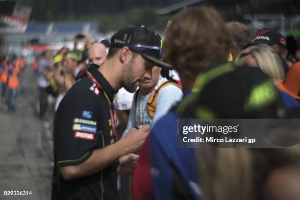 Jonas Folger of Germany and Monster Yamaha Tech 3 signs autographs for fans during the MotoGp of Austria - Preview at Red Bull Ring on August 10,...