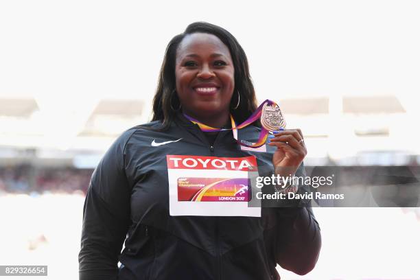 Michelle Carter of the United States collects her bronze medal following the womens shot put final during day seven of the 16th IAAF World Athletics...