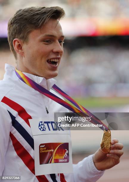 Gold medallist Norway's Karsten Warholm poses on the podium during the victory ceremony for the men's 400m hurdles athletics event at the 2017 IAAF...