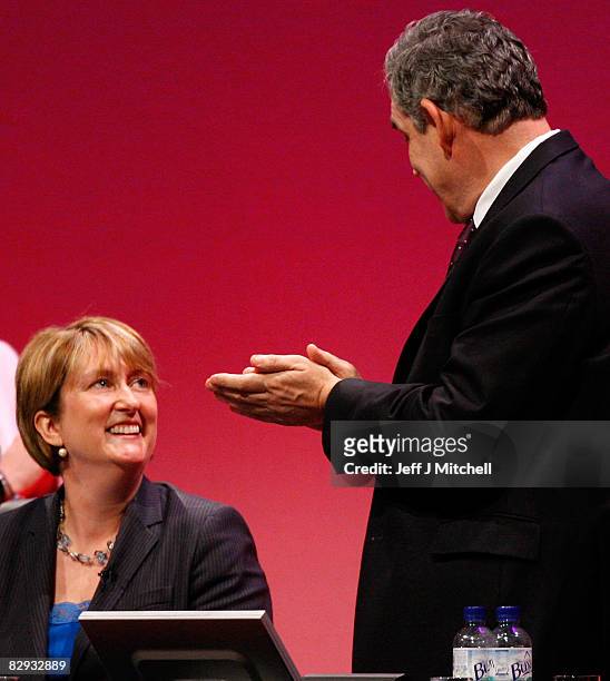 Prime Minister Gordon Brown applauds beside Home Secretary Jacqui Smith during the Labour Conference on September 21, 2008 in Manchester, England. On...