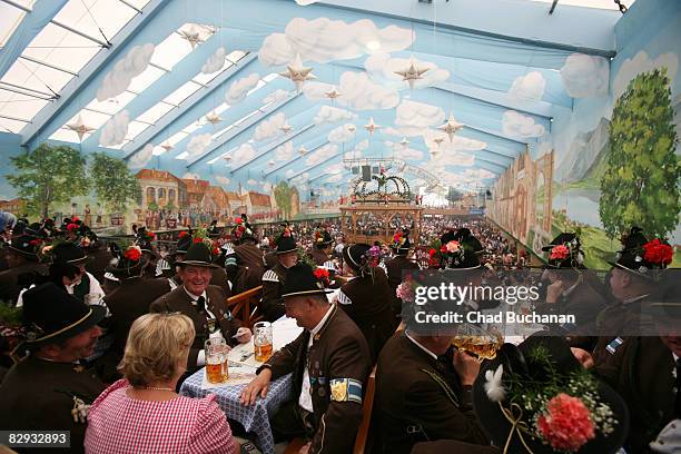 People in traditional Bavarian costumes at the Hacker-Pschorr tent during day 2 of the Oktoberfest beer festival on September 21, 2008 in Munich,...