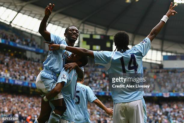 Shaun Wright-Phillips of Manchester City celebrates scoring his team's fourth goal with team mates Robinho and Jo during the Barclays Premier League...