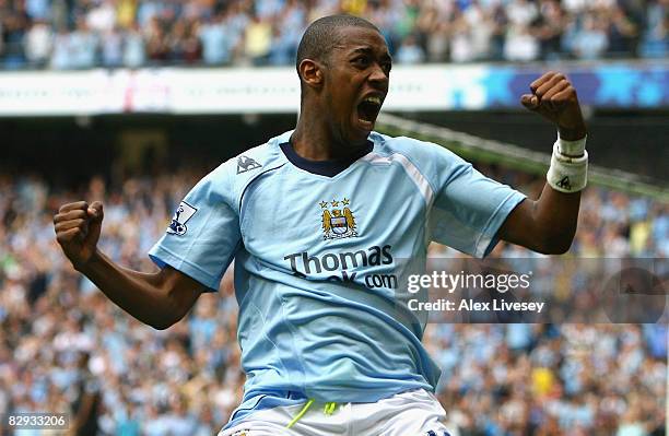 Gelson Fernandes of Manchester City celebrates scoring his team's sixth goal during the Barclays Premier League match between Manchester City and...