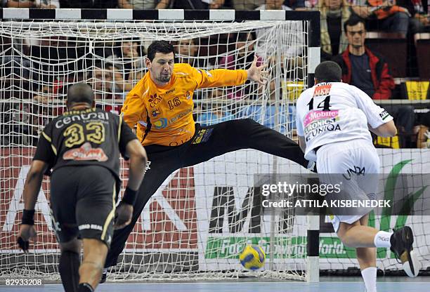 Hungarian player Marko Vujin of MKB Veszprem scores a goal against Spanish goalkeeper Arpad Sterbik in the local sport hall of Veszprem town on...