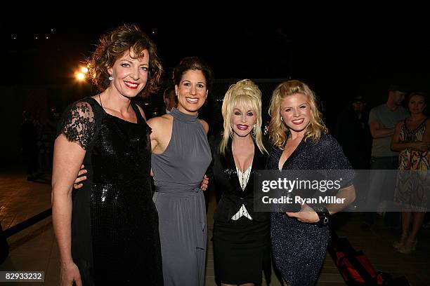 Cast members actors Allison Janney, Stephanie J. Block, Dolly Parton and Megan Hilty pose during the party for the world premiere of of "9 to 5: The...