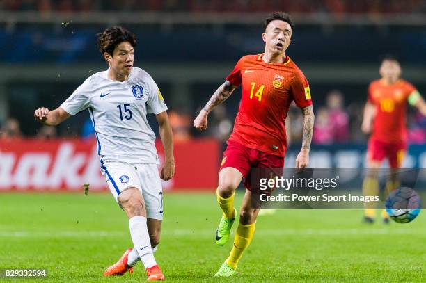 Hong Jeongho of Korea Republic fights for the ball with Wang Yongpo of China PR during their 2018 FIFA World Cup Russia Final Qualification Round...