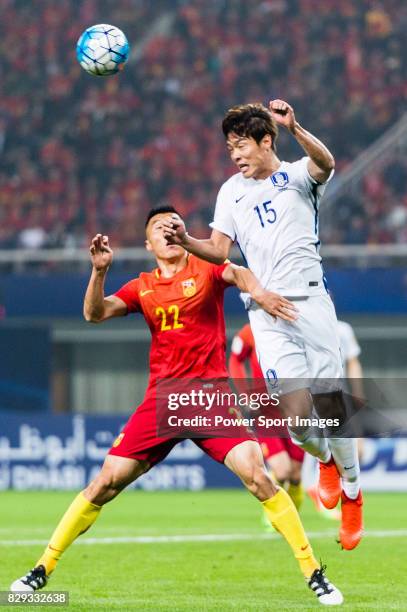 Hong Jeongho of Korea Republic competes for the ball with Yu Dabao of China PR during their 2018 FIFA World Cup Russia Final Qualification Round...