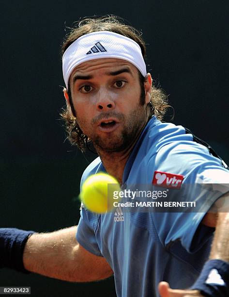 Chilean tennis player Fernando Gonzalez eyes the ball during the Davis Cup 2008 World Group play-offs match against Australian Chris Guccione on...