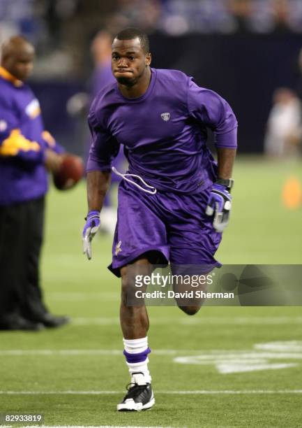 Running back Adrian Peterson of the Minnesota Vikings works out with team trainers prior to the game against the Carolina Panthers at the HH Humphrey...