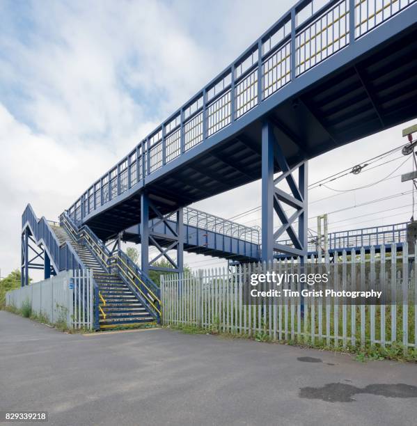 metal footbridge across a railway line - つり革 ストックフォトと画像