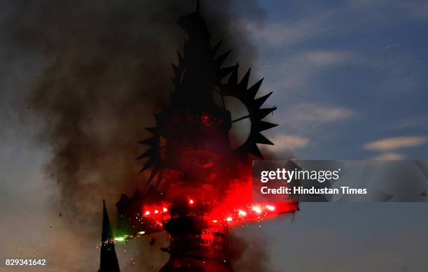 The effigy of Ravana being burnt to celebrate the festival of Dusshera that marks the end of nine days of Navratri at a Ram Leela performance at...