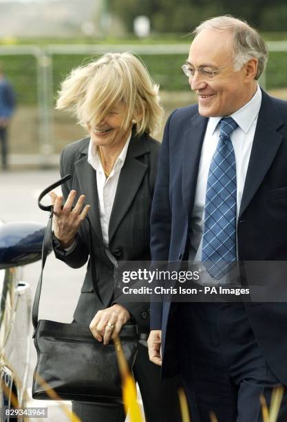 Conservative Party Leader Michael Howard and his wife Sandra get buffeted by the wind as they arrive in Bournemouth ahead on the party's annual...