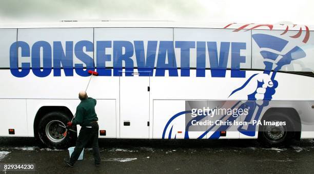 Michael Howard's battle bus featuring the Conservative Party's redesigned logo gets a clean in Bournemouth ahead on the party's annual conference...
