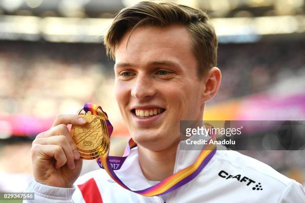 Gold medalist Karsten Warholm of Norway poses with his medal in the Men's 400 metres hurdles final during the "IAAF Athletics World Championships...