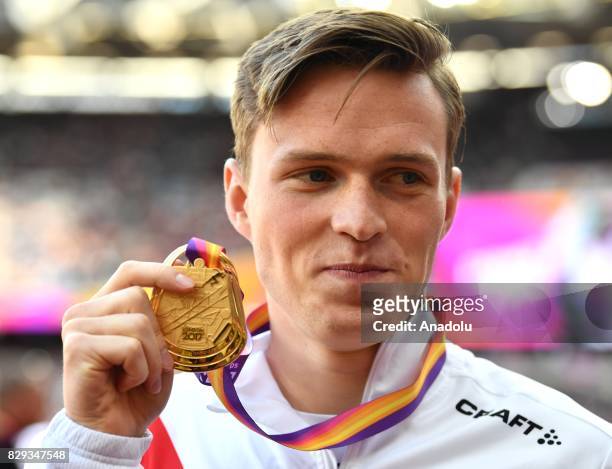 Gold medalist Karsten Warholm of Norway poses with his medal in the Men's 400 metres hurdles final during the "IAAF Athletics World Championships...