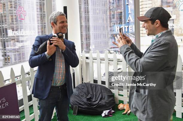 Andy Cohen poses with a North Shore Animal League America puppy at the Residence Inn by Marriott and North Shore Animal League America "Dog Days Of...