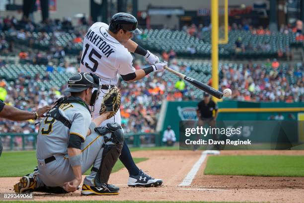 Mikie Mahtook of the Detroit Tigers hits a single in the first inning against the Pittsburgh Pirates during a MLB game at Comerica Park on August 10,...