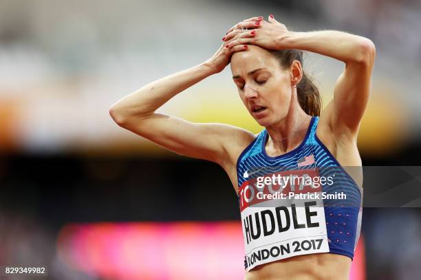 Molly Huddle of United States holds her head in her hands in reaction after the womens 5000 metres heats during day seven of the 16th IAAF World...