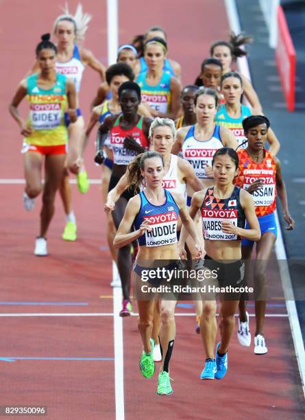Molly Huddle of United States leads from Rina Nabeshima of Japan as they compete in the womens 5000 metres heats during day seven of the 16th IAAF...