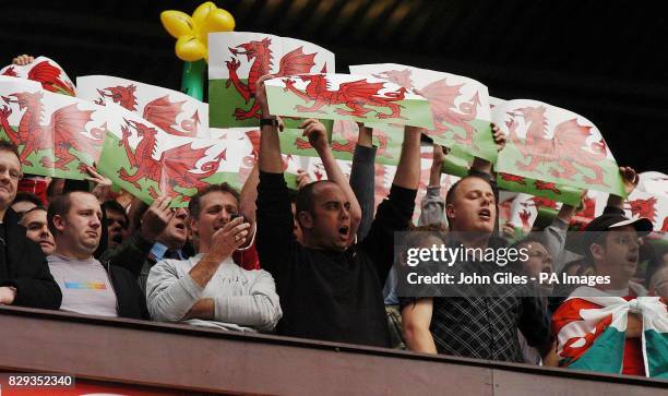 Welsh supporters cheer Wales onto the pitch for their World Cup qualifying Group six match against England at Old Trafford, Manchester. THIS PICTURE...
