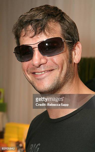 Actor Adam Kassen poses with the Beryll Eyewear display during the HBO Luxury Lounge in honor of the 60th annual Primetime Emmy Awards featuring the...