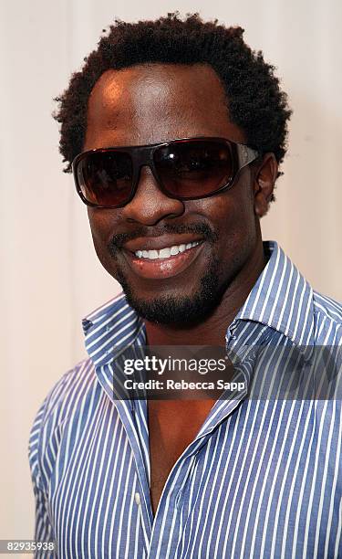 Director Gbenga Adewuyi poses with the Beryll Eyewear display during the HBO Luxury Lounge in honor of the 60th annual Primetime Emmy Awards...