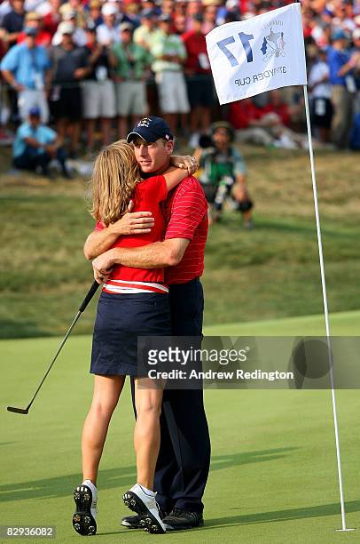 Jim Furyk of the USA team hugs his wife Tabitha after defeating Miguel Angel Jimenez 2 & 1 to secure the Ryder Cup for the USA during the final day...