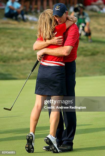 Jim Furyk of the USA team hugs his wife Tabitha after defeating Miguel Angel Jimenez 2 & 1 to secure the Ryder Cup for the USA during the final day...