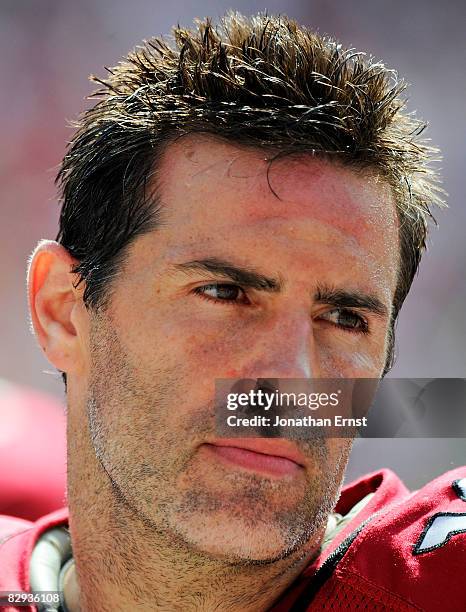Kurt Warner of the Arizona Cardinals stands on the sideline between series against the Washington Redskins at FedEx Field September 21, 2008 in...