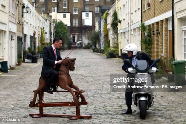 Passer-by stops and stares as jockey Frankie Dettori sits on a chocolate horse outside Hyde Park Stables in central London. Dettori, the star of a...