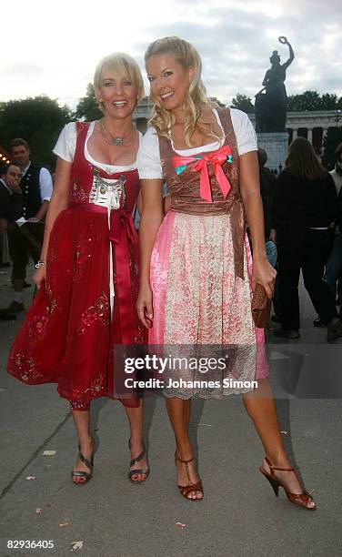 Alexandra Rietz and TV presenter Tina Kaiser arrive for the 'Kaefer's Almauftrieb' party at Kaefer beer tent during day 2 of Oktoberfest beer...