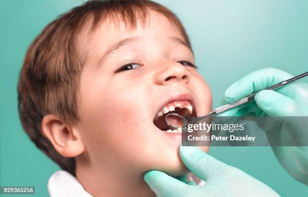 happy boy's appointment at dentist - kinderzahnheilkunde stock-fotos und bilder