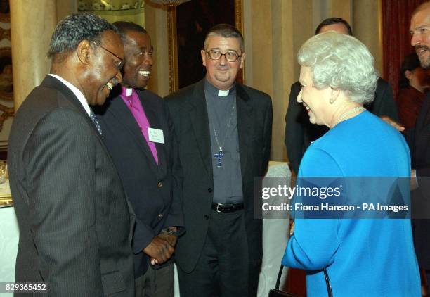 Queen Elizabeth II with, from left, Chief Emeka Anyaoku, International President of WWF, Revd Jericho Sikwiilala, Development Coordinator at the...