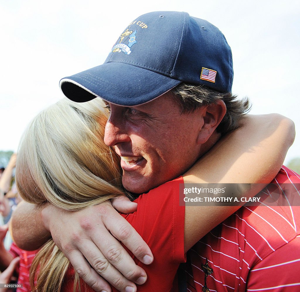 Phil Mickelson of Team USA gets a hug on