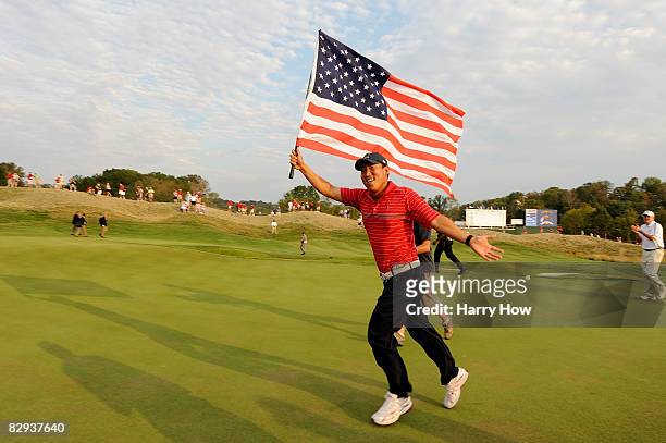 Anthony Kim of the USA celebrates with an American flag after the USA 16 1/2 - 11 1/2 victory on the final day of the 2008 Ryder Cup at Valhalla Golf...
