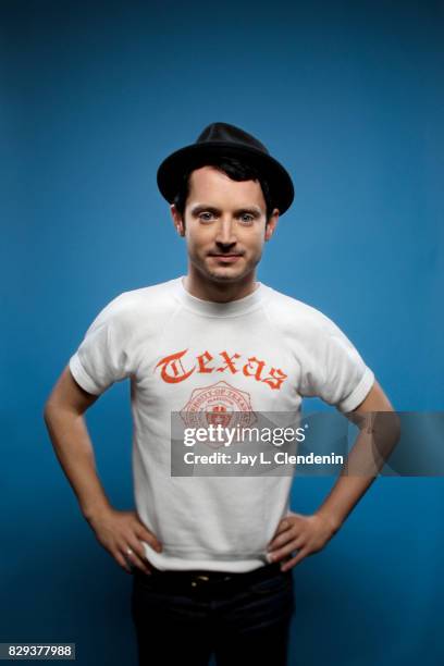 Actor Elijah Wood from the television series, "Dirk Gently's Holistic Detective Agency," is photographed in the L.A. Times photo studio at Comic-Con...