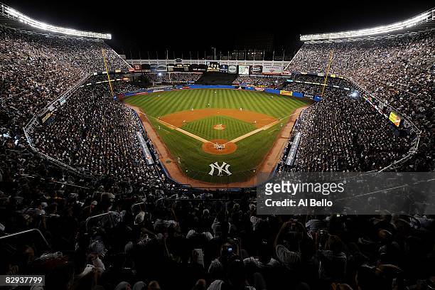 General view as Andy Pettitte of the New York Yankees throws the first pitch of the game to Brian Roberts of the Baltimore Orioles during the last...